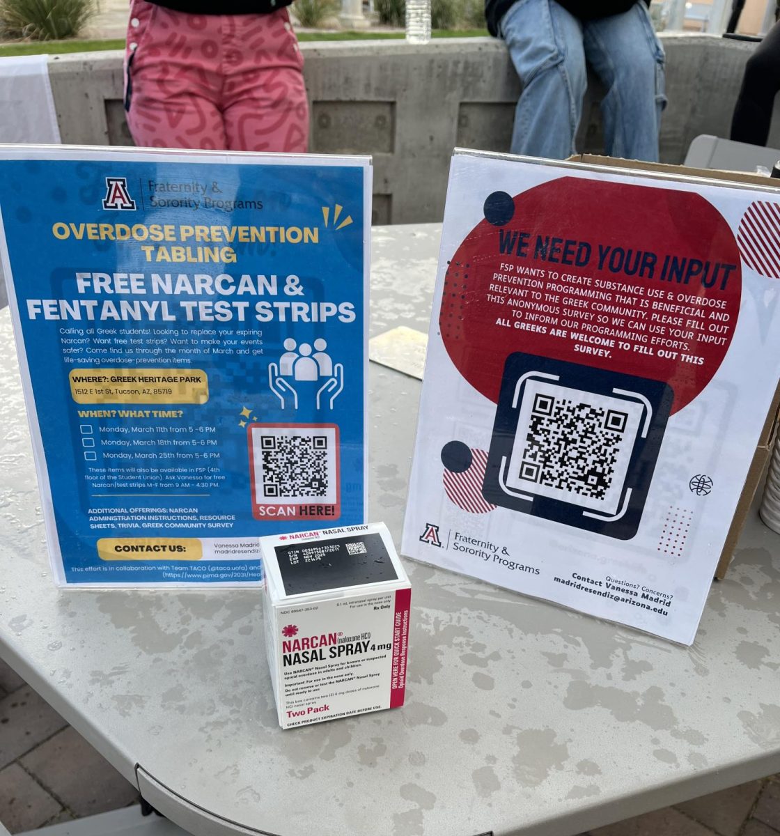 A box of Narcan and QR Code surveys for students to fill out during free Fentanyl and Narcan handout provided by UA TACO and Fraternity and Sorority Programs on March 25 at Greek Heritage Park on the University of Arizona Campus.