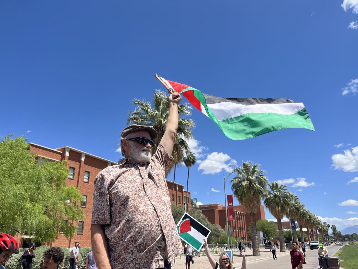 Pro-Palestine protesters wave flags in support of a ceasefire in Gaza.