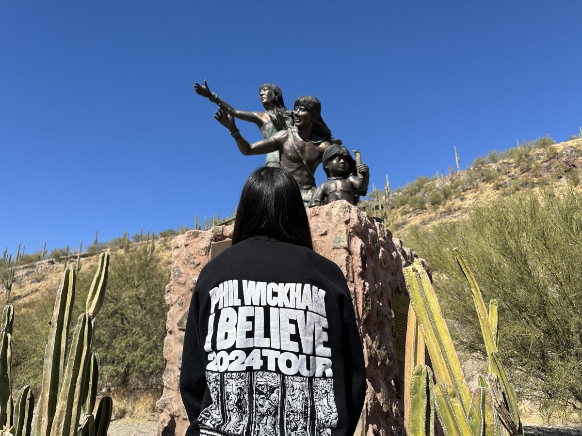 Ruth Mountz, 19, visits a Native American statue called the First Sighting on 400 S. Mission Road, representing the O’odham tribe’s first sighting of Europeans on Saturday, Feb. 22, 2025.