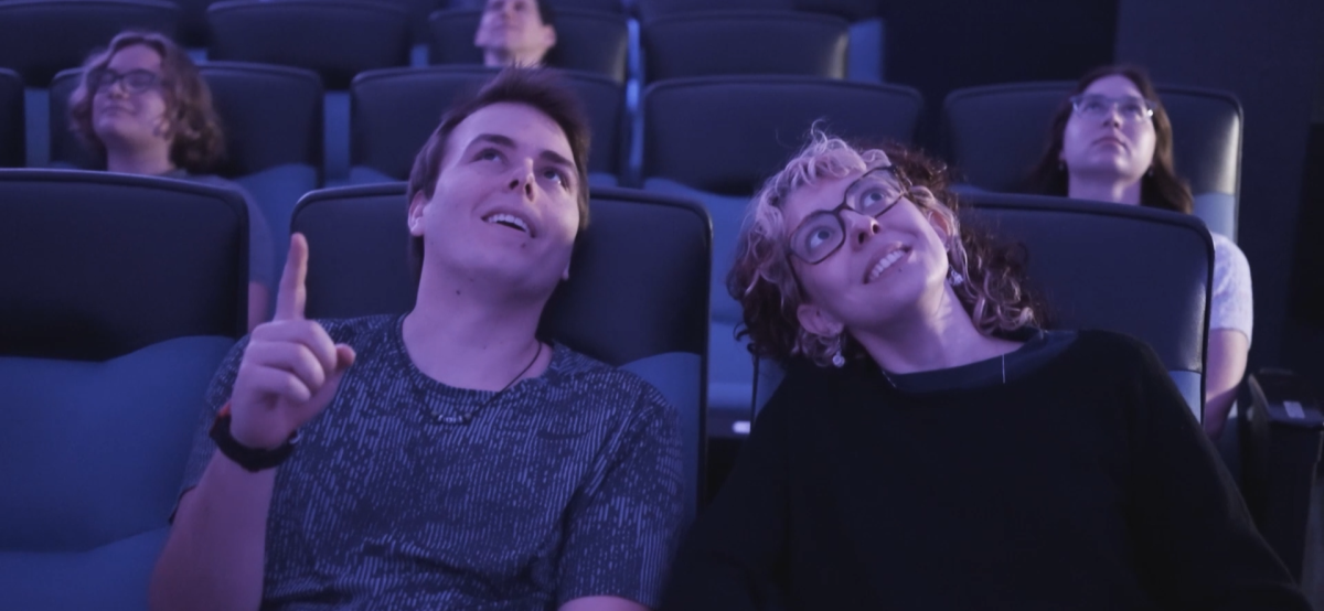 A couple in the planetarium looking up at the dome.