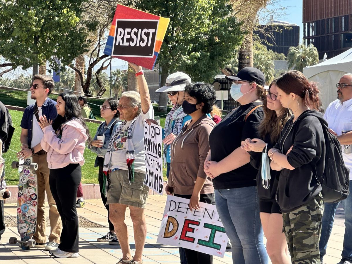 Protestors in support of diversity, equity and inclusion gather in front of the administration building at the University of Arizona on Feb. 27, 2025.