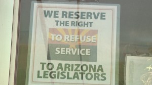 This sign in the window of Rocco's Little Chicago Pizzeria in Tucson received national attention after the owner put it up in response to the passage of SB1062 in the State Senate and House 