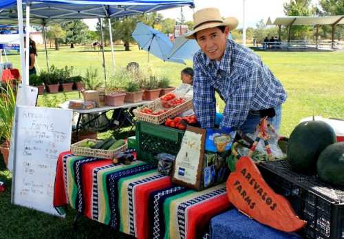 A farmer from Arevalos Farms sells produce at the Sierra Vista Farmers Market.