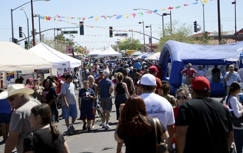 Community members fill South Fourth Avenue for the Feria de Sur Tucson on Sunday, April 6, 2014. (Photograph by Ryan Revock)
