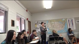 Dr. Michelle Berry gives a lecture at St. Gregory College Preparatory School in Tucson, Ariz. 
