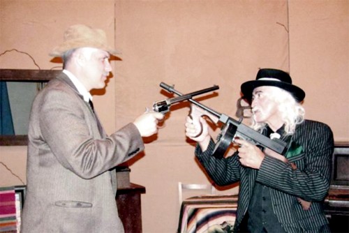 It’s six-guns vs. Tommy-guns as Wyatt Earp and Cal Capone square off in the Tombstone Repertory Company production of “Prohibition Comes to Tombstone.” Pictured are Rick Chandler as Wyatt Earp and Jose Torres as Cal Capone. 