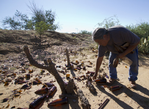  Kyle Mittan / Arizona Sonora News Pablo collects bottles on an October afternoon. Pablo says he enjoys the quiet of the desert, and the time the trips give him to think.