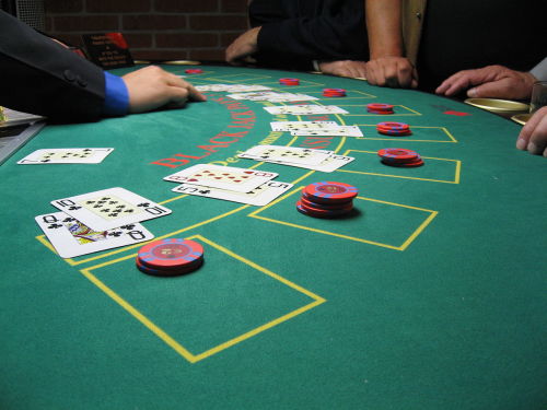 Action at a blackjack table. Creative Commons licensed photo.