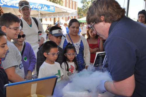 Children observe as a science demonstration is put on at last years SciTech Festival. Photo by Jeremy Babendure/Executive Director Arizona SciTech Festival.