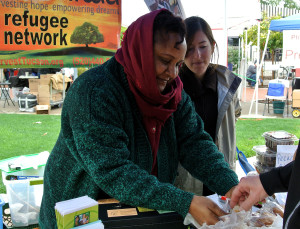 Yewbdar Ergete gives samples of her homemade Ethiopian bread at St. Phillip's Farmers' Market on Sunday, February 1, 2015. Ergete sold all of her bread by the end of the day. (Photo by: Holly Regan/Arizona Sonora News Service)