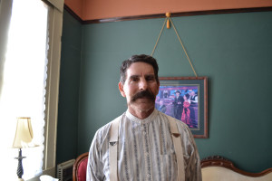Kenn Barrett, the secretary of the Tombstone Chamber of Commerce and chairman of the Tombstone Historic District Commission, stands in the Tombstone Visitor Center, which was previously a bank and a hospital. (Photo by: Gabby Ferreira/Arizona Sonora News)
