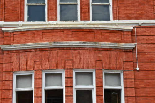 The bank's façade. Architects used techniques that add texture to brick walls.