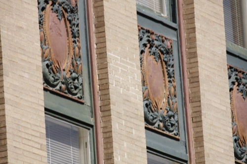 Intricate designs above windows are a common feature.