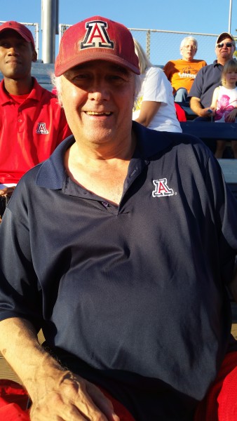 Joe "Super Fan" Flanatry watching the softball team compete in a fall exhibition game at Hillenbrand stadium. Photographer: Hallie Wilson