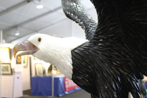 A gem eagle sculpture carved by artist Daniel Venturini at the JG&M Expo of the Tucson Gem, Mineral and Fossil Showcase in Tucson, Ariz. on Jan. 30, 2016. The eagle, according to Venturini, is made from White Calcite, Black Dolomite and Agate. (Photo by Maggie Driver)