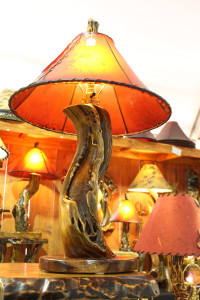A wooden lamp on display made by Chris Jafferis, a designer and co-owner of Sticks n Stones, shown at the Kino Gem & Mineral Show, a part of the Tucson Gem, Mineral and Fossil Showcase in Tucson, Ariz. on Feb. 3, 2016. According to Jafferis, his wooden lamps often have a long process of creation before they come out as a final product, making them unique. (Photo by Maggie Driver)