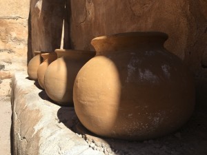 Old pots sit in one of the adobe rooms at Tumacácori National Park. (Photo by: Sara Cline)