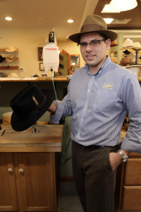 Eric Watson holds a $1,500 fedora he just completed for a customer in Washington. Watson is the owner and hatter at Watson's Hat Shop in Cave Creek. Photo by Karen Schaffner/Arizona Sonora News Service
