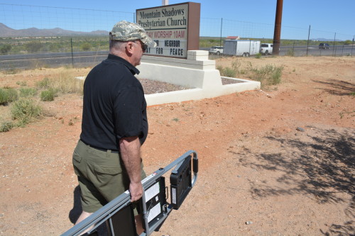 Garry Lawrence heading to fix a sign at his church (Photo by: Zach Armenta/ Arizona Sonora News)