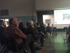 Rodger Featherstone listens to the presentation by the Tonto National Forest Service at a public meeting in April. 
