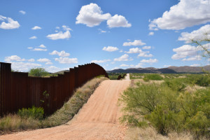 The U.S.-Mexico border fence extends through the Altar Valley near the Baboquivari Mountains in the area where the Arizona Border Recon camps out looking for border crossers. (Photo by Kendal Blust/Arizona Sonora News)