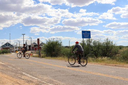 Joan Moreno and his work partner bike back to El Sasabe, Sonora after working at Rancho de la Osa in Sasabe, Arizona on Sept. 14. Joan lives in Tucson, but stays in El sasabe when he works on the ranch. (Photo by Corinna Tellez/ Arizona Sonora News)