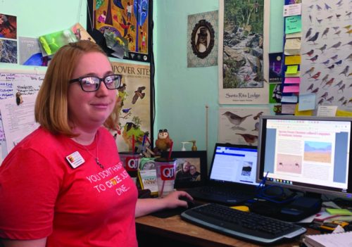 Bird conservation biologist Jennie MacFarland works at her desk at the Tucson Audubon Society headquarters. (Photo by Kelly Huang)