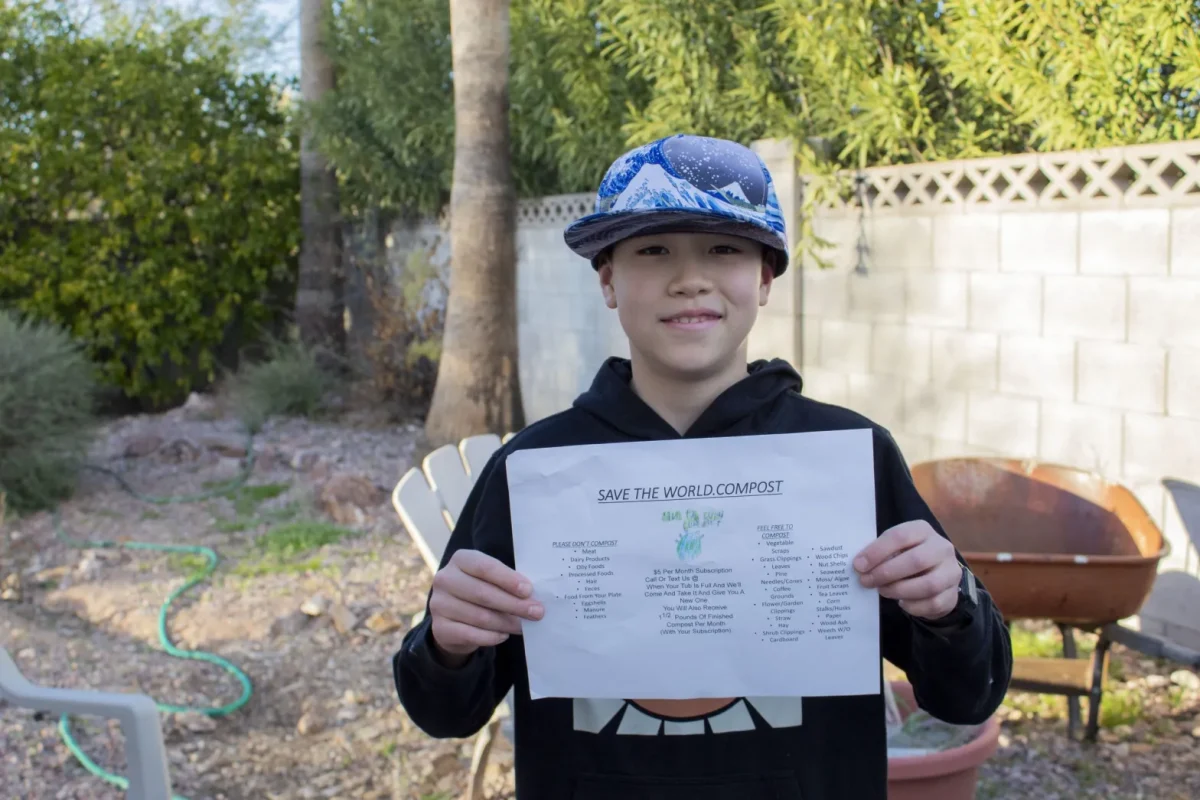 David, 12, holds the flier used to promote business on Jan. 30. David is one of the kids who created local business SavetheWorld.Compost, a company dedicated to composting within their neighborhood. 
