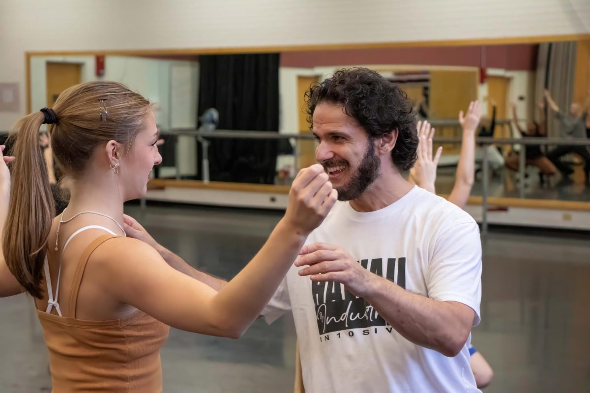 Tyce Diorio helps Madelyn Hofer in his intermediate jazz class Sept. 11 in the Ina E. Gittings building at the University of Arizona.