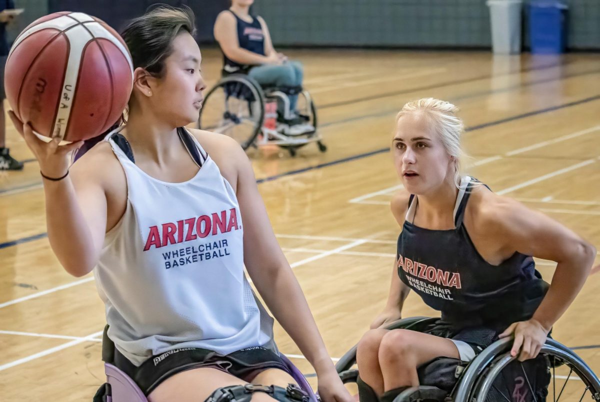 Abigayle Dunn, a senior on the women’s wheelchair basketball team guards sophomore Samantha Fraser in practice on Wednesday, Sept. 25 at University of Arizona’s South REC building.