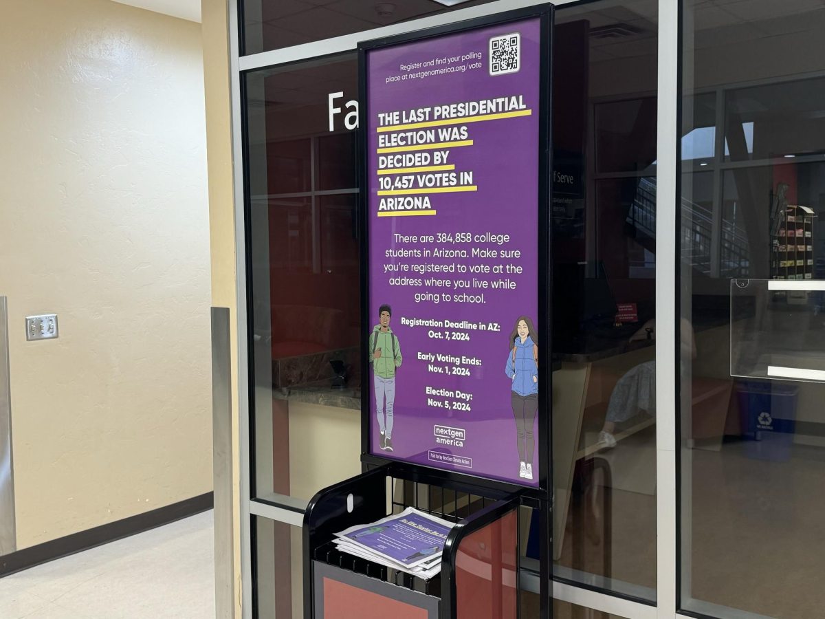 A sign in the University of Arizona Student Union encouraging students to vote on Oct. 7.