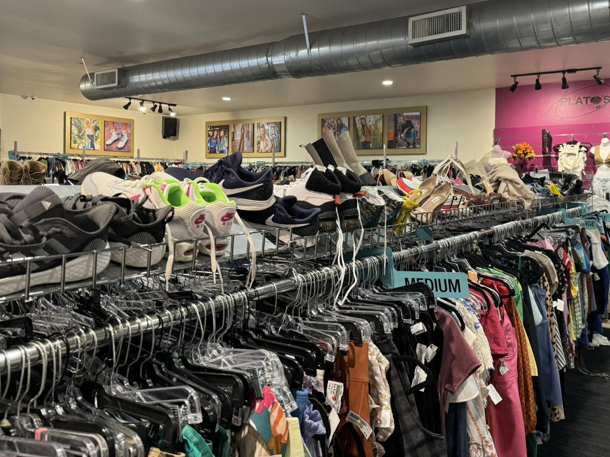 Plato’s Closet carries designer clothes alongside department store styles at its east side location.
