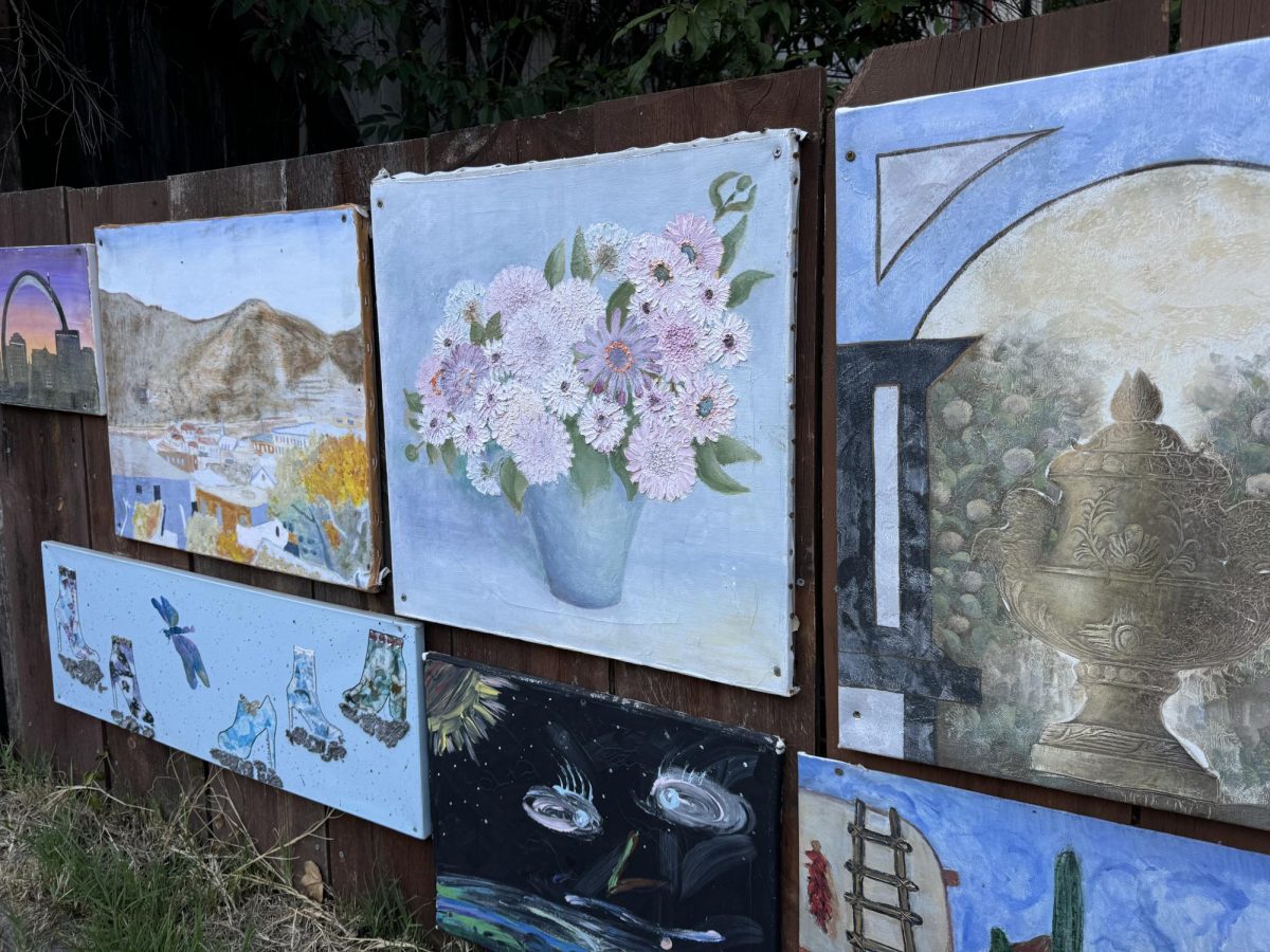 Locals place art on the fences along the walkways in Bisbee, AZ.