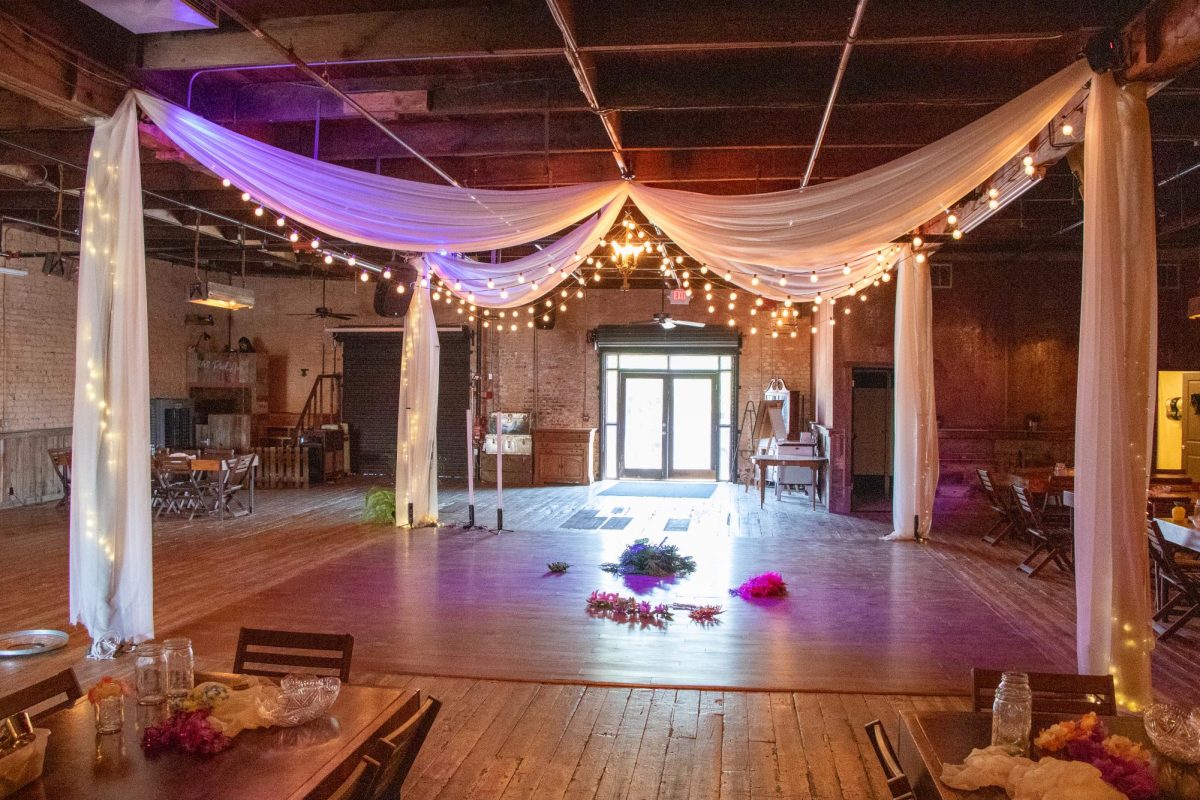 The dance floor is in the middle of the reception hall at Park Ave.