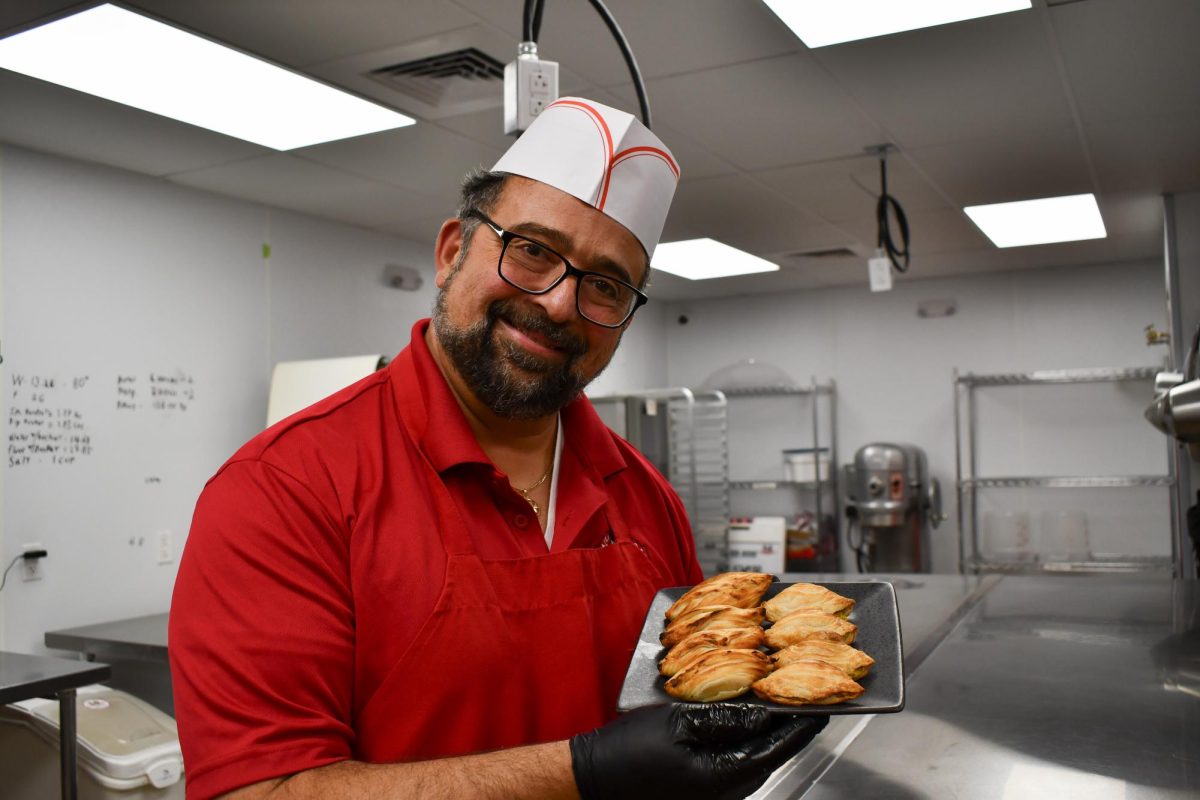 Joe Gauci of Malta Joe's Baked Goods holds up some freshly baked pastizzi.