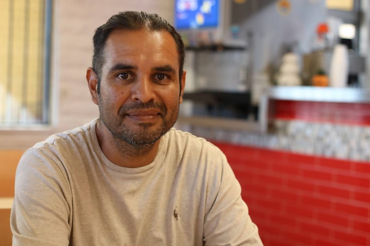 Eleazar Beltran smiles inside his restaurant, Paco's Mexican Food, on Oct. 15. Beltran said a half-page newspaper article put Paco's on the map.