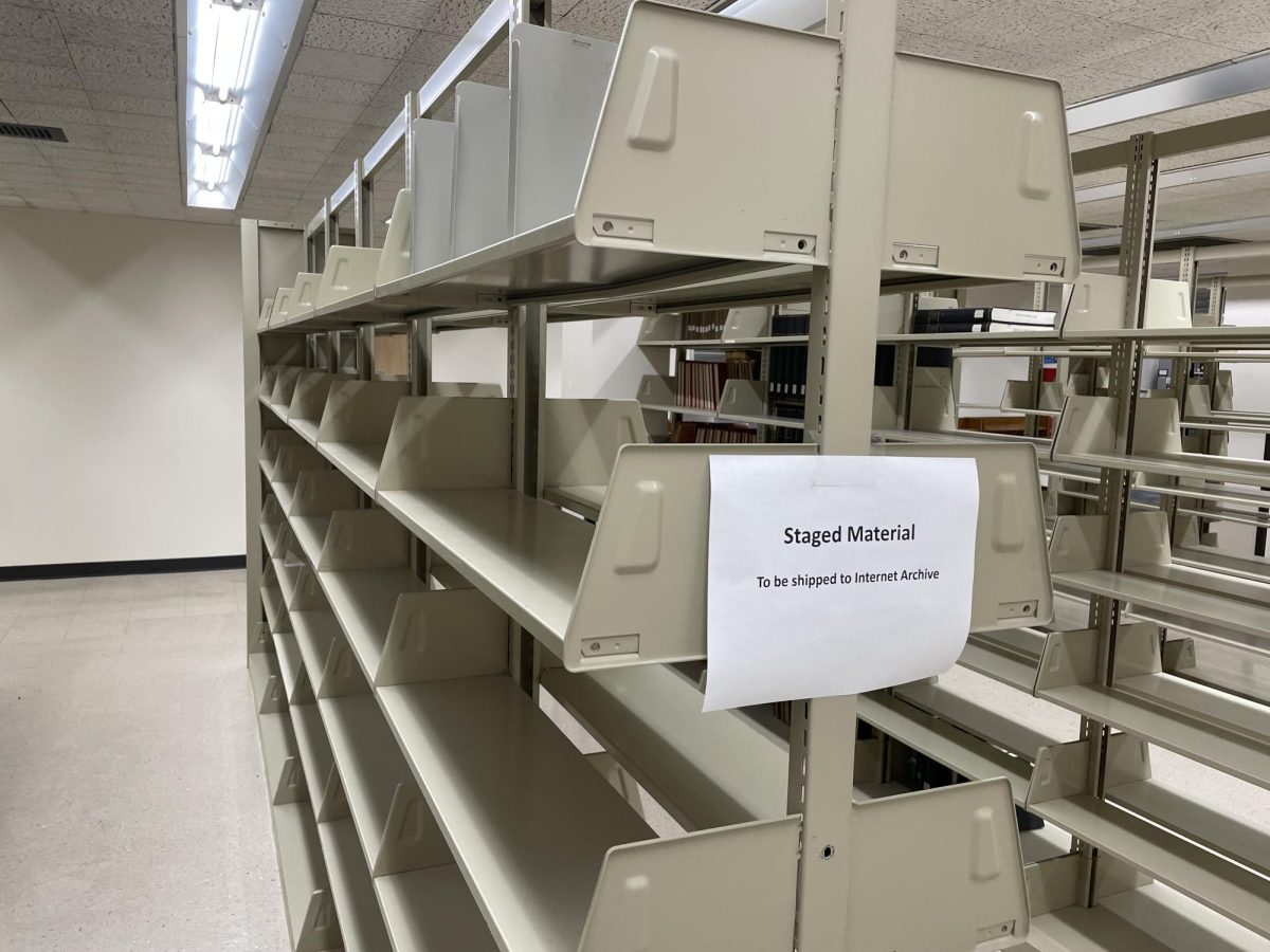 Empty bookshelves in the Albert B. Weaver Science and Engineering Library that once held hard copies, now replaced by digital online formats for UA students