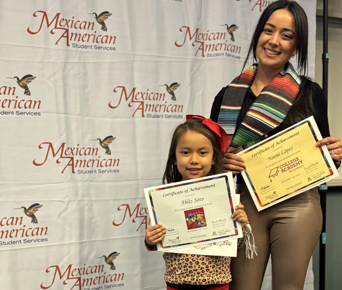 Ahliz Soto and Noemi Lopez proudly hold their certificates of achievement from Mexican American Student Services Department’s College Academy for Parents.