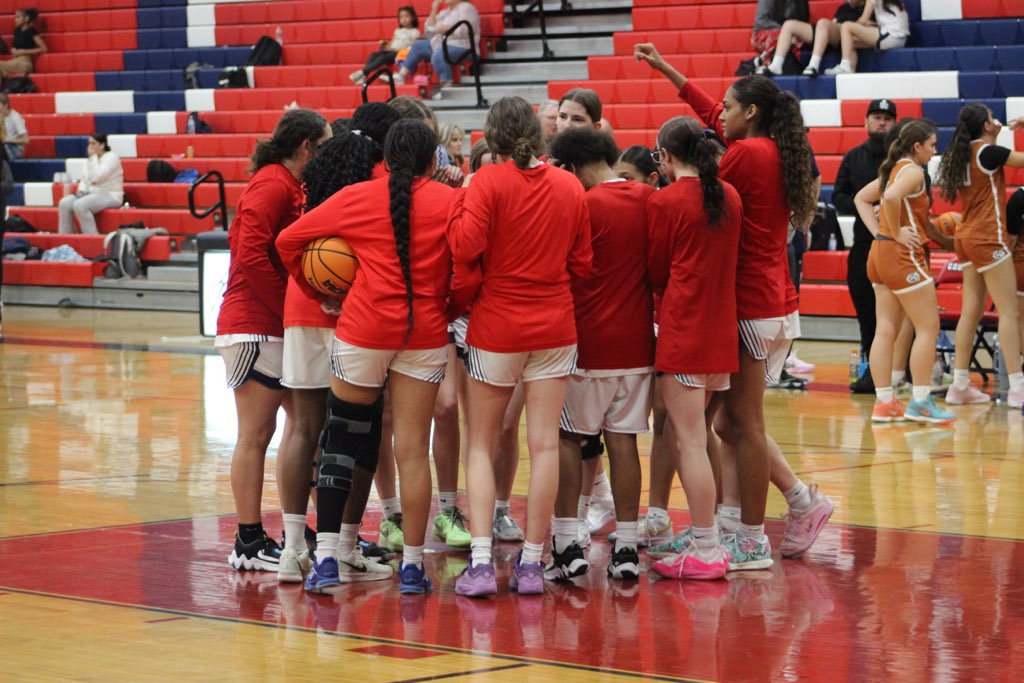 The Sahuaro girls' basketball team huddles before a game at Sahuaro High School in Tucson, Ariz. Photo courtesy of Steve Botkin.