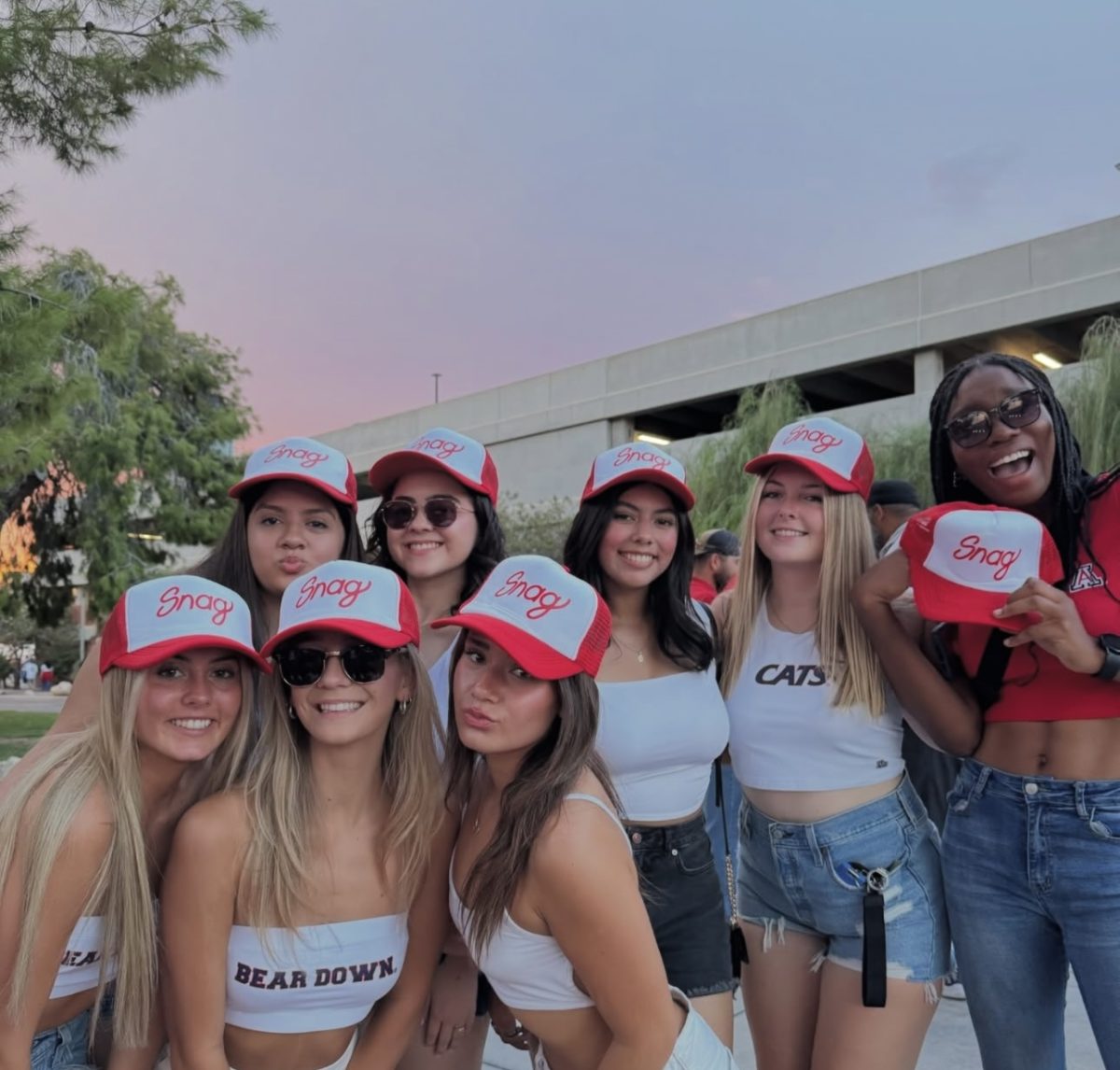 UA students pose in Snag hats. (Photo courtesy of UofA Snag)
