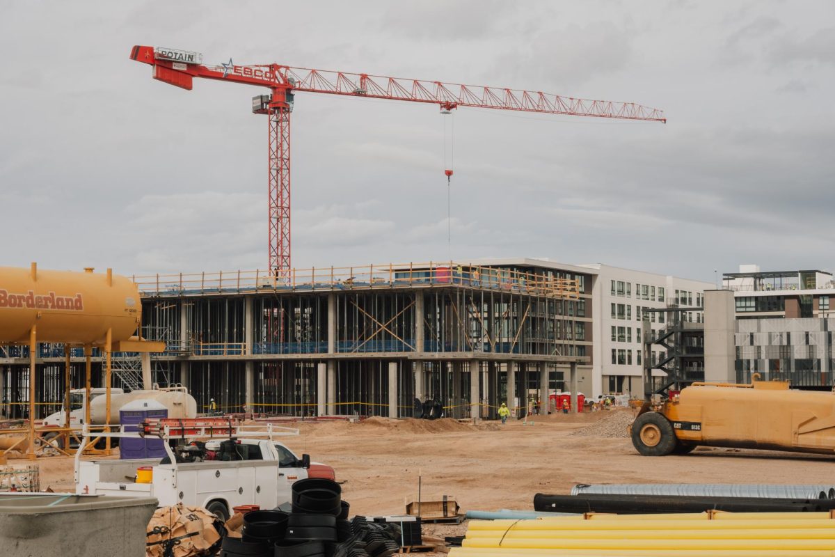 Construction continues on multi-story buildings at the Uptown development at 7401 N. La Cholla Blvd. on Nov. 19. The project transforms the former Foothills Mall site into a mixed-use development with apartments, retail and entertainment.