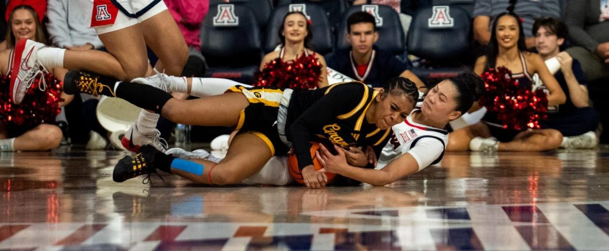 Guard Mireia Jurado and a Grambling State Tiger fight for the ball in McKale Center in Tucson, Ariz., on Nov 16.