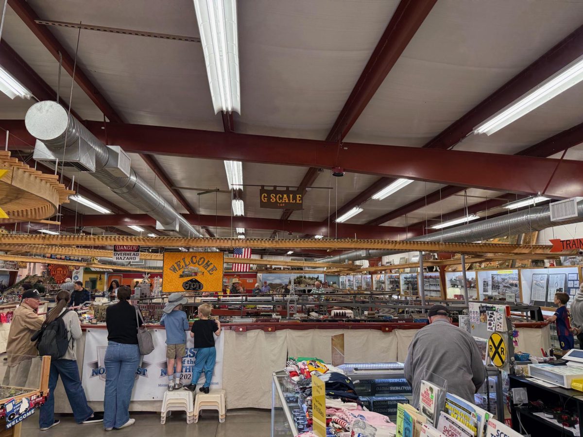 Visitors watch trains just inside the entrance of the Gadsden-Pacific Division Toy Train Museum in Tucson, Ariz. on Jan. 25, 2026.