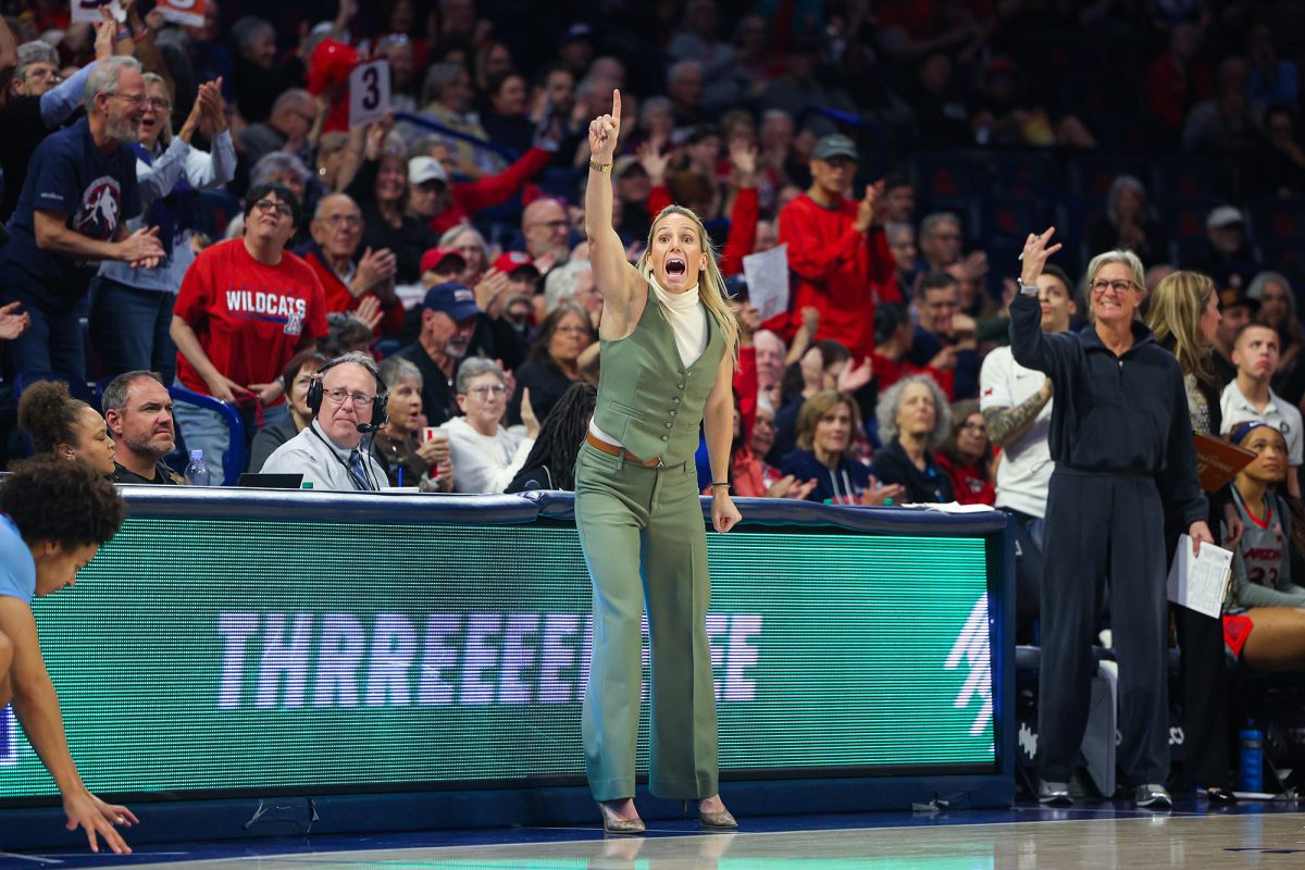 Coach Becky Burke on the sideline as the Wildcats score a three pointer against The University of Kansas at McKale Center January 20th, 2025. 