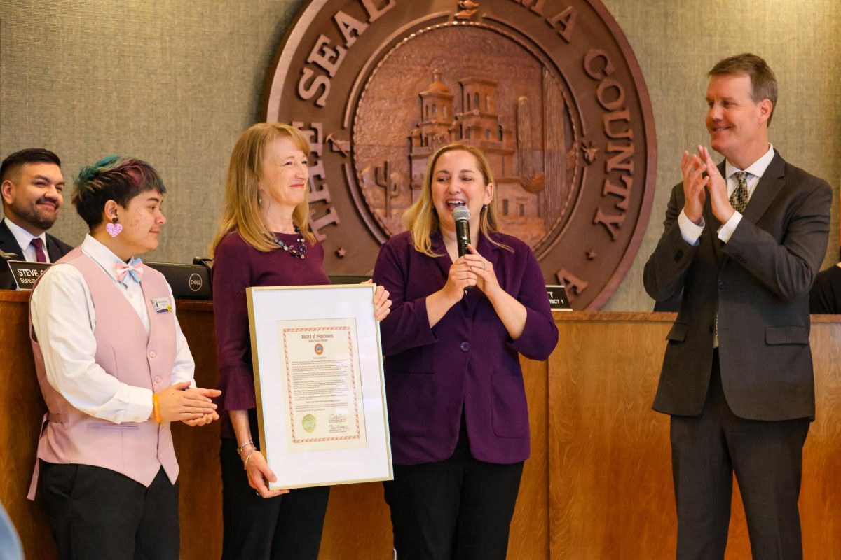 District 1 Supervisor Rex Scott presents CEO Elizabeth Slater, Board President Katie Maxwell and program graduate Vita Rodriguez with a proclamation making Feb. 1, 2026 “Youth on Their Own Day in Pima County” to on Feb. 17, 2026. The proclamation was affirmed in conjunction with the program’s 40-year anniversary.