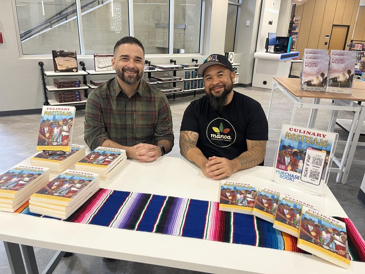 Felipe Hinojosa and Rudy Guevarra, editors of “Culinary Mestizaje,” pose for a photo at their book signing at the University of Arizona Campus Store on March 19, 2026. (Photo courtesy of Michelle Tellez)