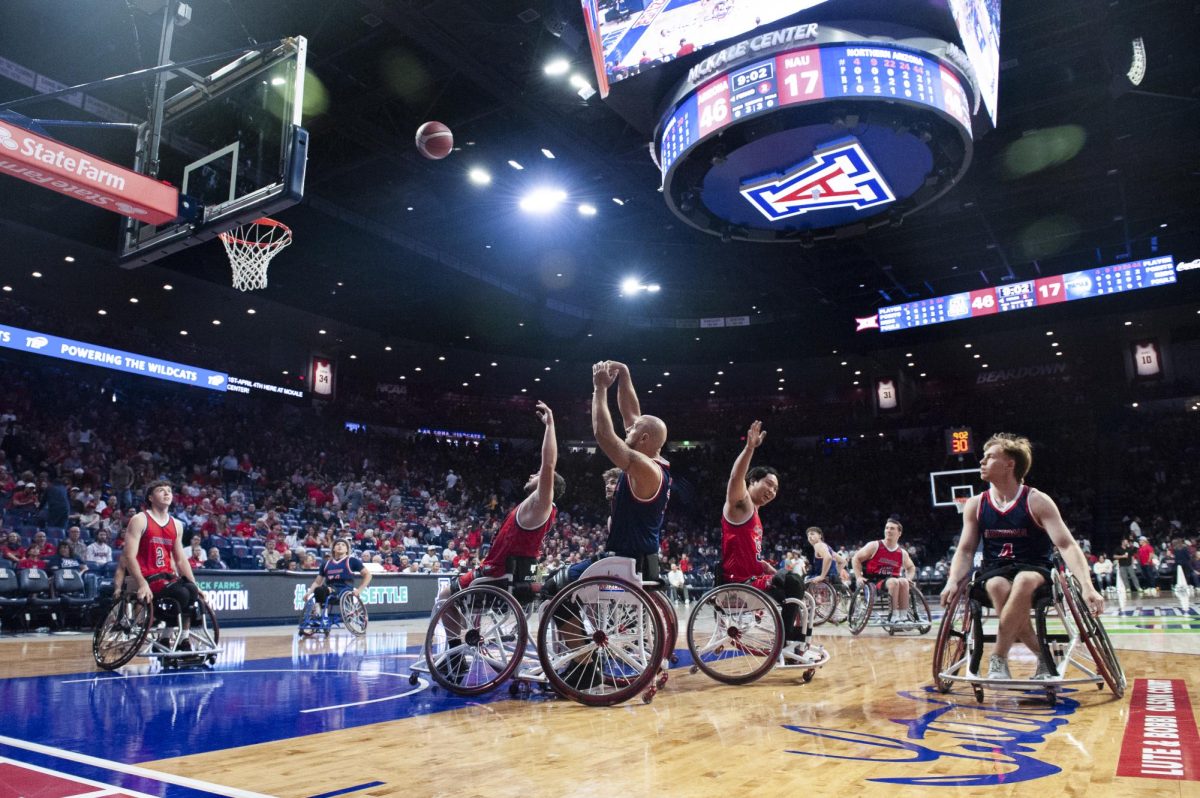 UA Men's Wheelchair basketball players playing in an exhibition game at McKale Center. They will be defending their national title next week. Photo by Aiden Gravelle.