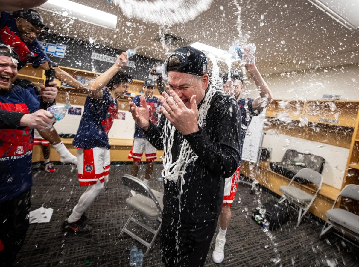UA players celebrated the March 28 Elite Eight victory over Purdue in the locker room with UA Coach Tommy Lloyd, who got doused with water. The Wildcats meet Michigan in the Final Four in Indianapolis on Saturday, April 4, 2026. (Photo by Mike Christy/UA Athletics)
