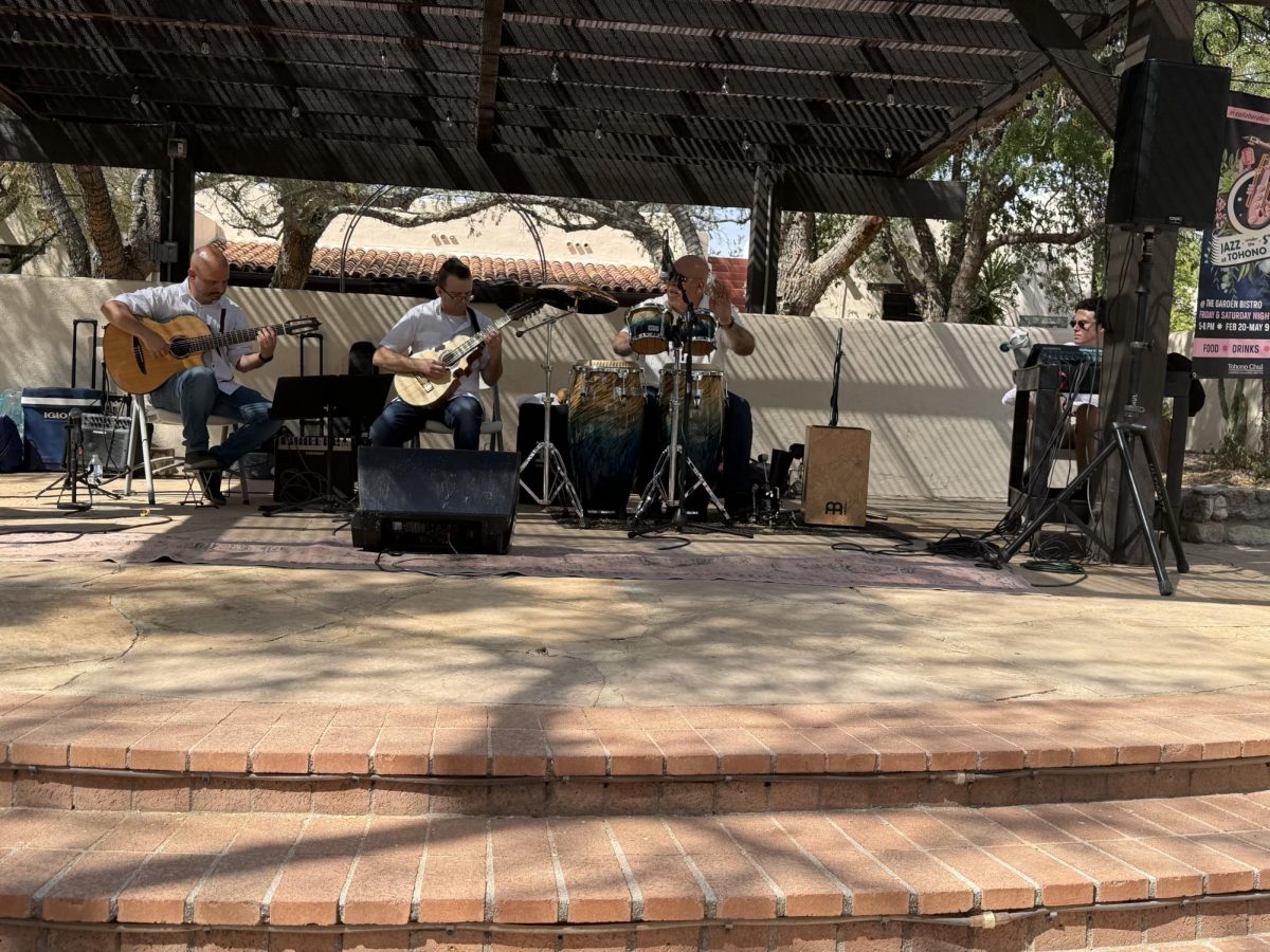 Members of the Puerto Rican folk group Grupo Riken retune their instruments before playing their second set during Tohono Chul Park’s Concert in the Garden on a recent Sunday