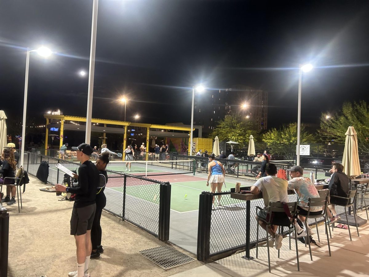 Pickleball players wait for an open court at Corbett’s in Tucson, Ariz. on April 1, 2026. Customers are served food and beverages between games. 